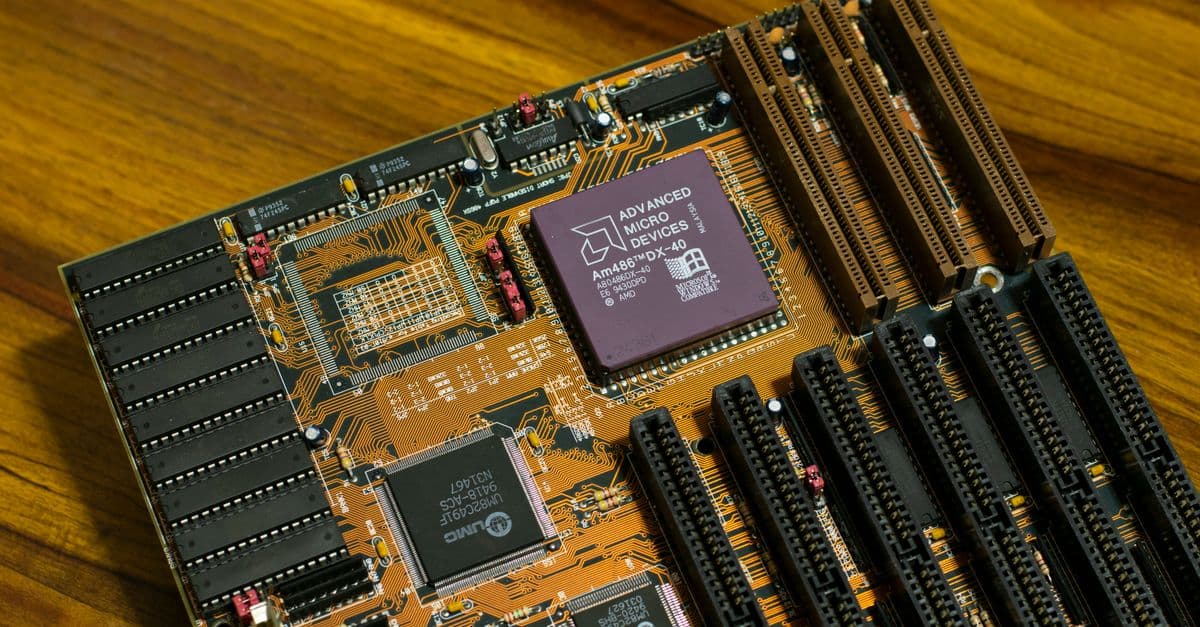 Close-up of a vintage AMD motherboard featuring the AM486 DX processor, showcasing retro computing technology.