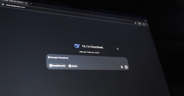 A dark-themed chat interface displaying an AI assistant conversation starter on a screen.