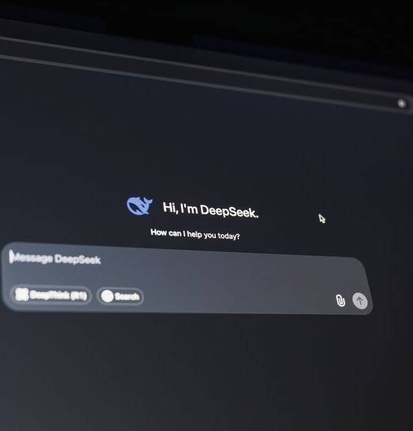A dark-themed chat interface displaying an AI assistant conversation starter on a screen.