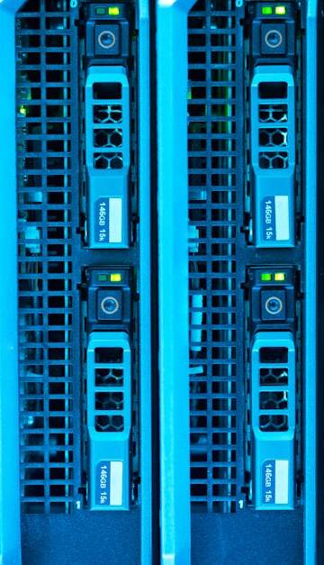 Detailed image of illuminated server racks showcasing modern technology infrastructure.