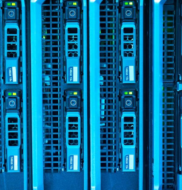 Detailed image of illuminated server racks showcasing modern technology infrastructure.