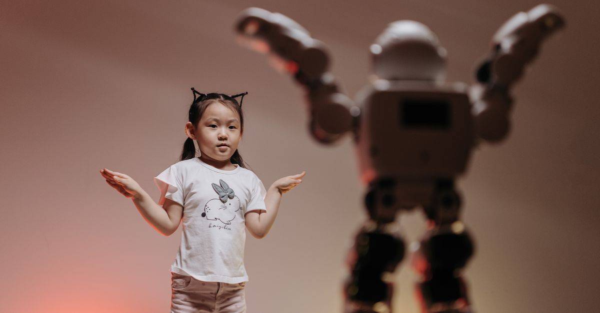 Child interacting with futuristic robot in a playful setting, showcasing modern technology.