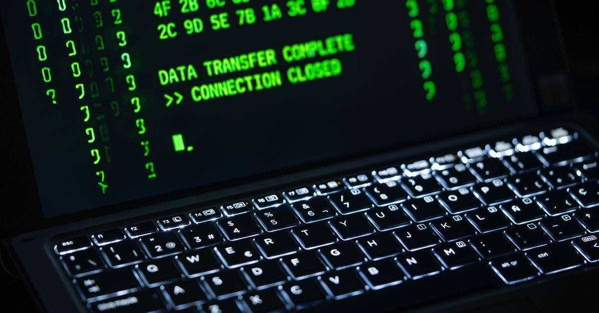 Close-up of a laptop screen displaying green code text. Perfect for cybersecurity themes.