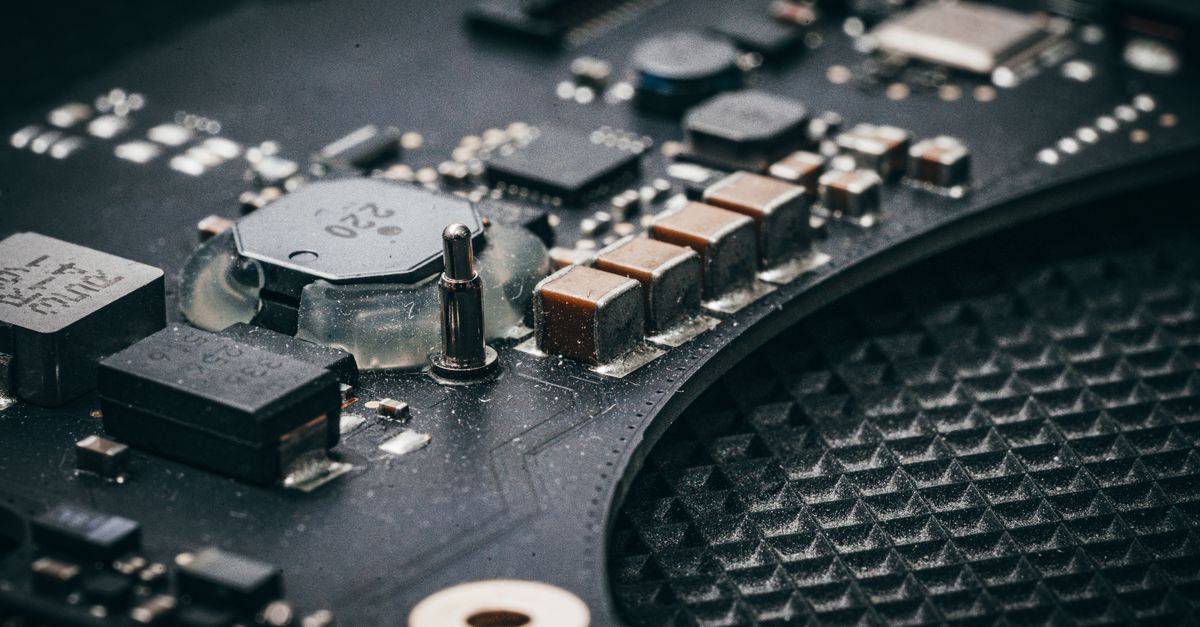 Detailed macro shot of an electronic circuit board showcasing various components.