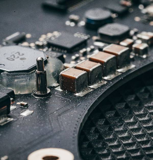 Detailed macro shot of an electronic circuit board showcasing various components.