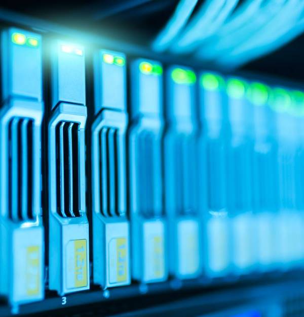 Detailed image of a server rack with glowing lights in a modern data center.