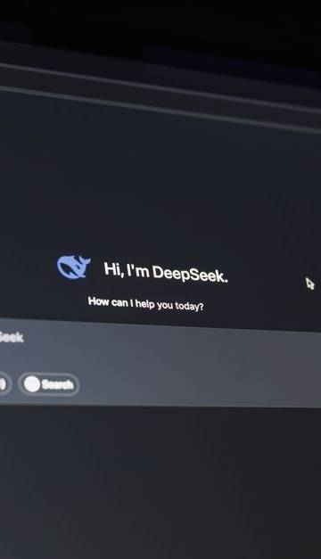 A dark-themed chat interface displaying an AI assistant conversation starter on a screen.