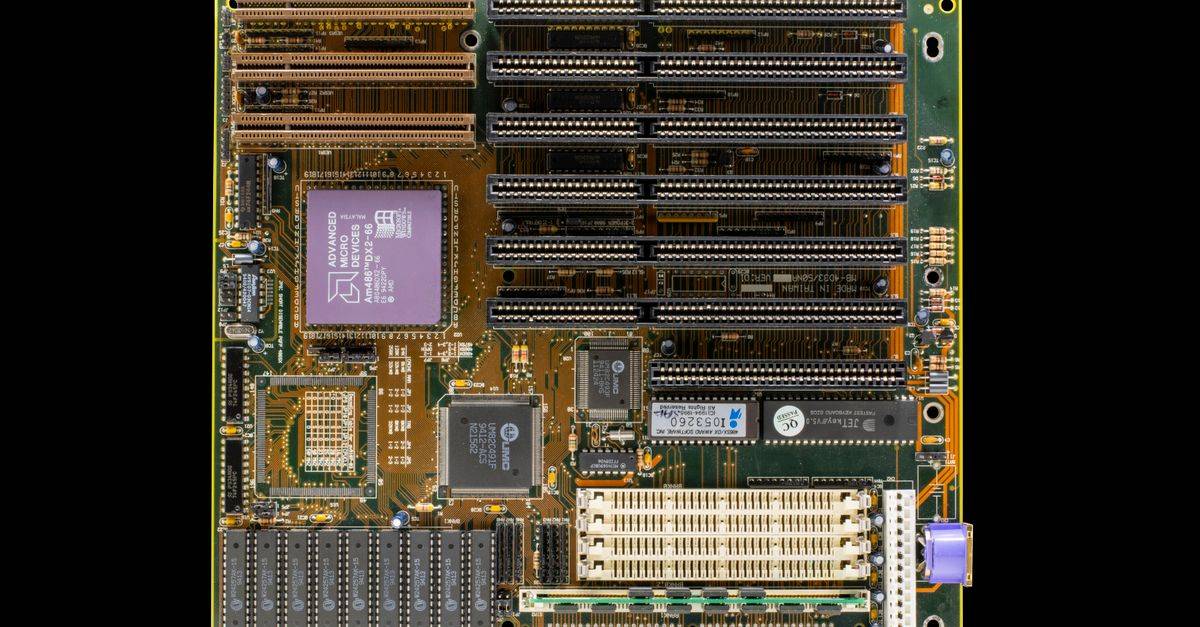 High-resolution photo of a vintage computer motherboard showcasing intricate electronic components and circuitry.