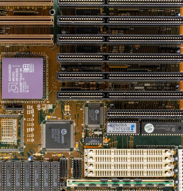 High-resolution photo of a vintage computer motherboard showcasing intricate electronic components and circuitry.