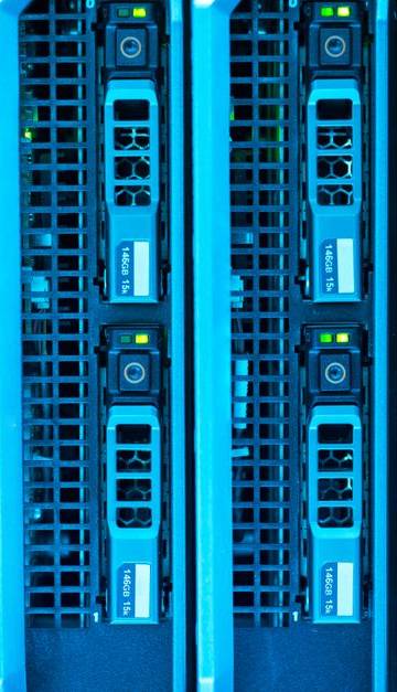 Detailed image of illuminated server racks showcasing modern technology infrastructure.