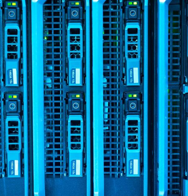 Detailed image of illuminated server racks showcasing modern technology infrastructure.