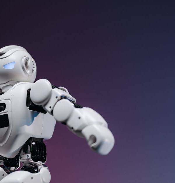 Close-up of a futuristic robotic toy against a gradient background, symbolizing innovation and technology.