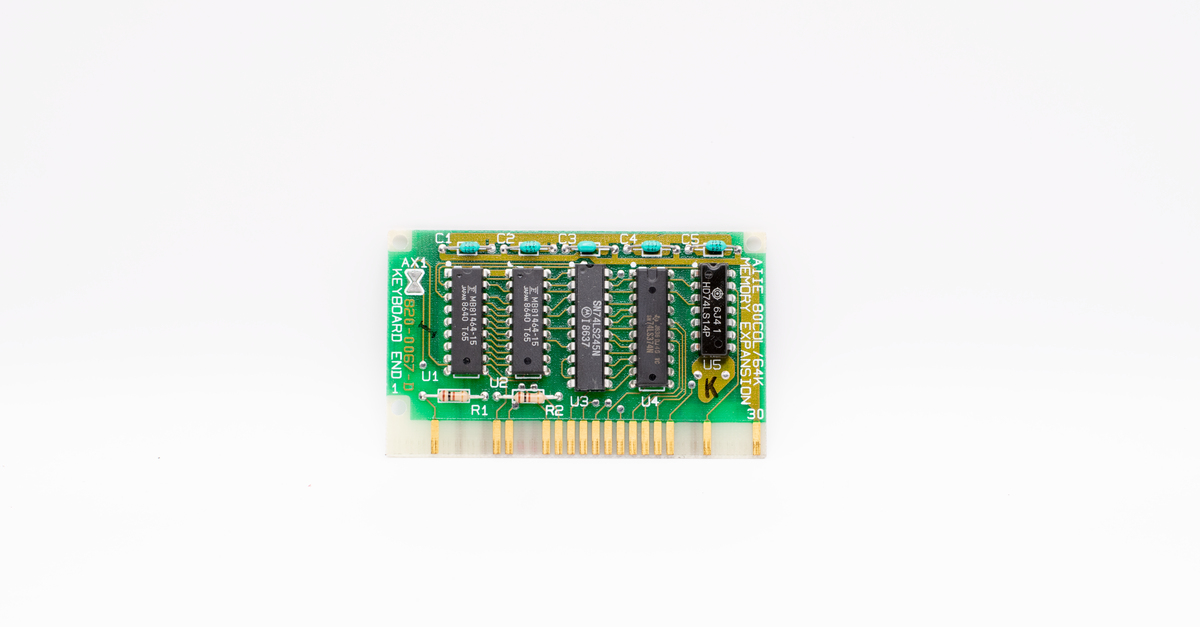A close-up of a vintage circuit board with microchips, showcasing retro technology and design.