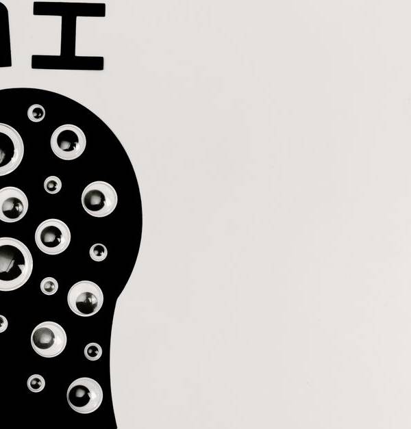Abstract illustration of AI with silhouette head full of eyes, symbolizing observation and technology.