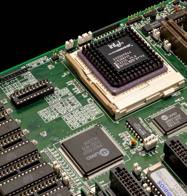 Detailed shot of a vintage motherboard showcasing microprocessor and electronic components.