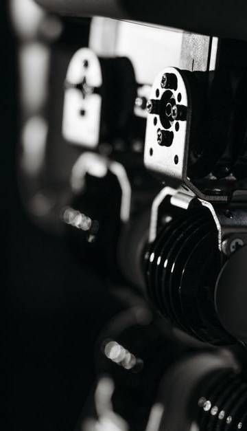 Detailed close-up of a robot's mechanical components, emphasized by moody studio lighting.