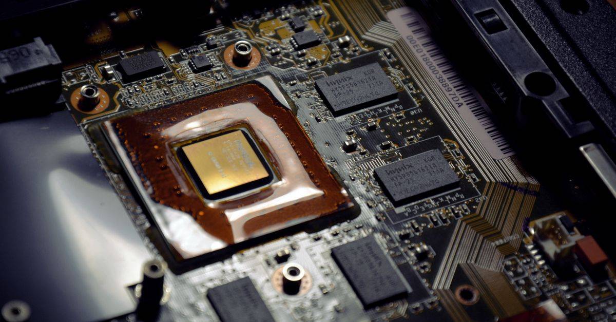 Detailed view of computer processor on motherboard with visible components and circuits.