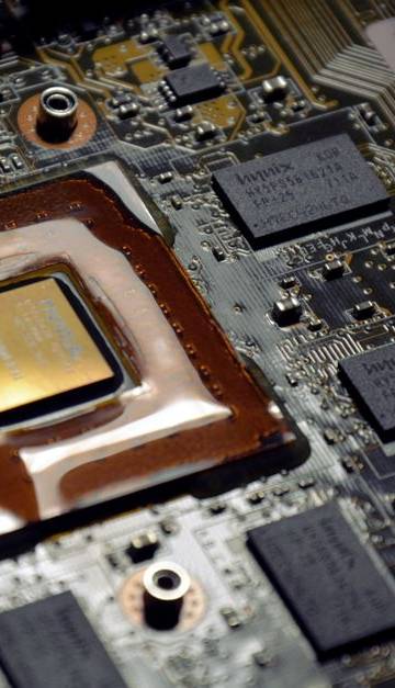 Detailed view of computer processor on motherboard with visible components and circuits.