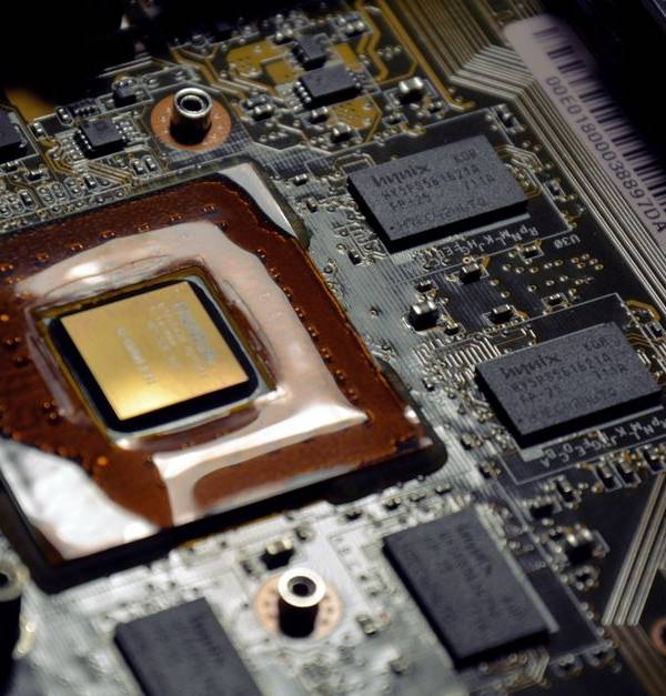 Detailed view of computer processor on motherboard with visible components and circuits.