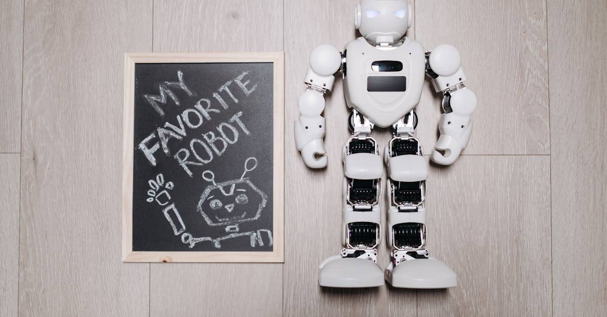 Overhead shot of a robot toy alongside a chalkboard drawing, on a light wooden floor.