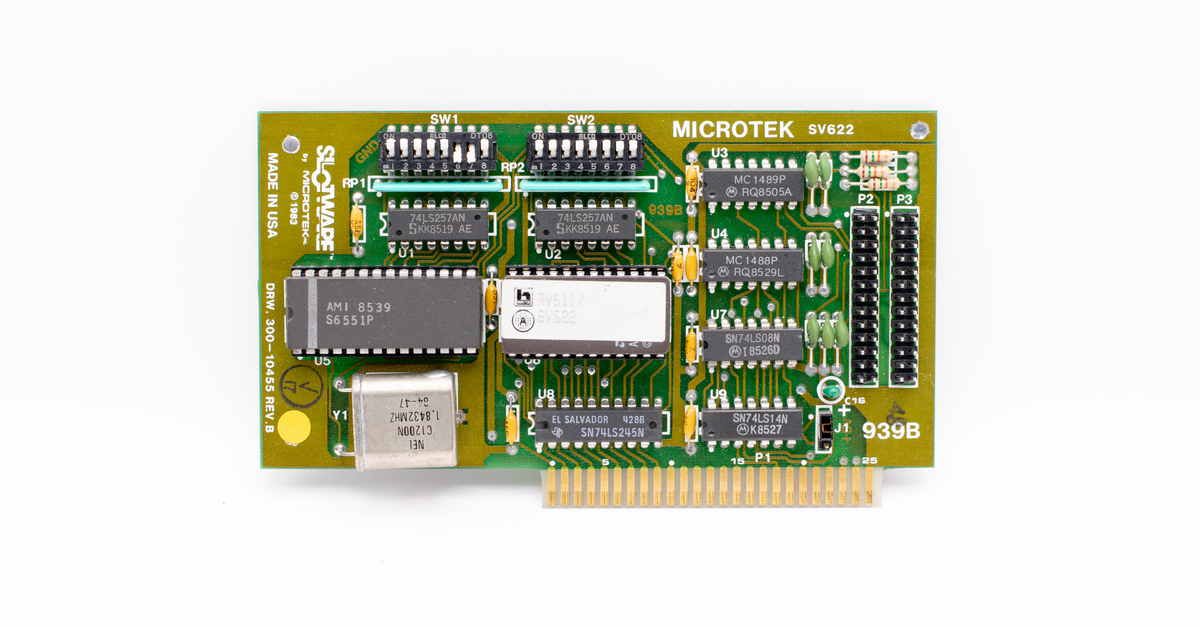 Close-up of a vintage Microtek circuit board, showcasing detailed components and design.