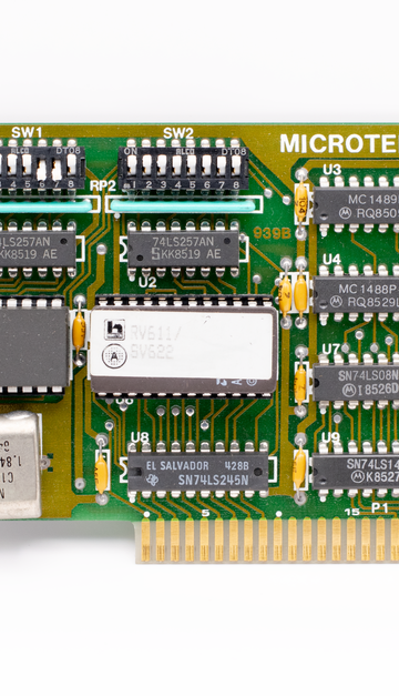 Close-up of a vintage Microtek circuit board, showcasing detailed components and design.