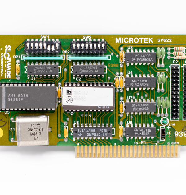 Close-up of a vintage Microtek circuit board, showcasing detailed components and design.