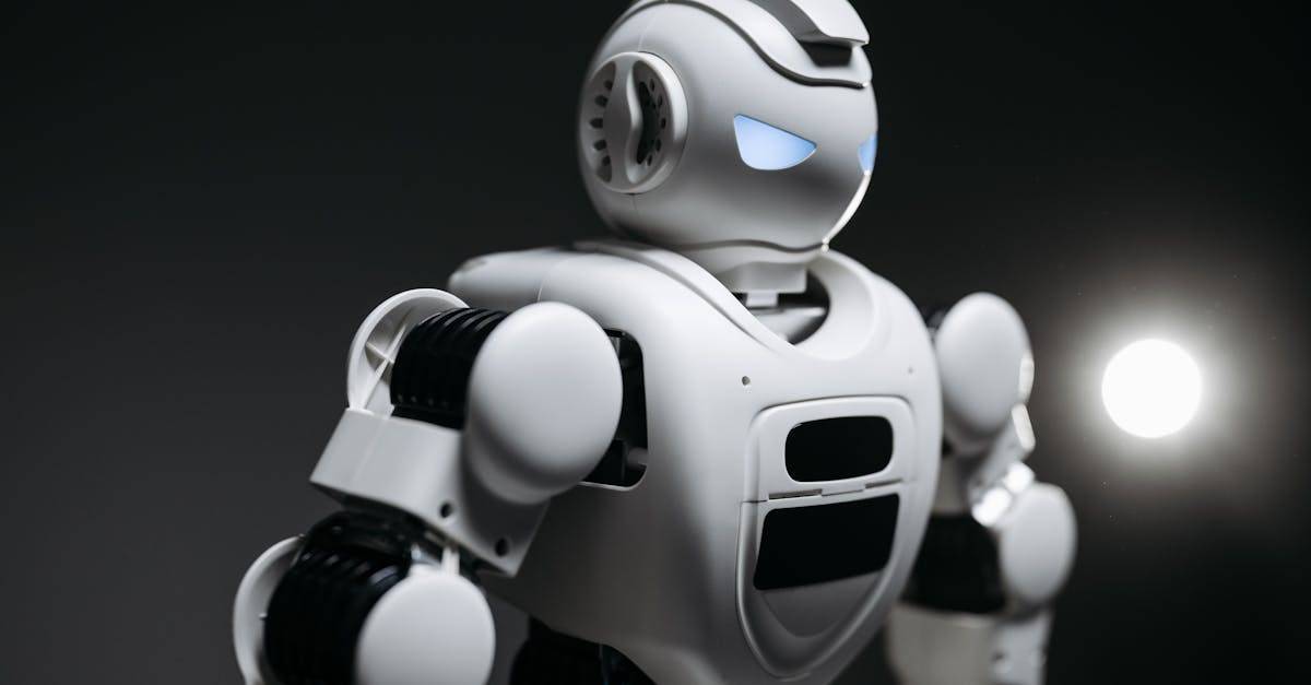 High-detail close-up image of a white robot with glowing eyes in studio lighting. Modern tech innovation.