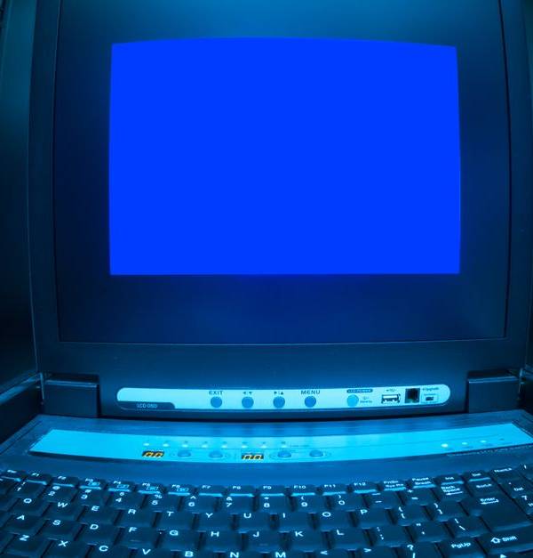 Close-up of a blue screen error shown on a data center control terminal.