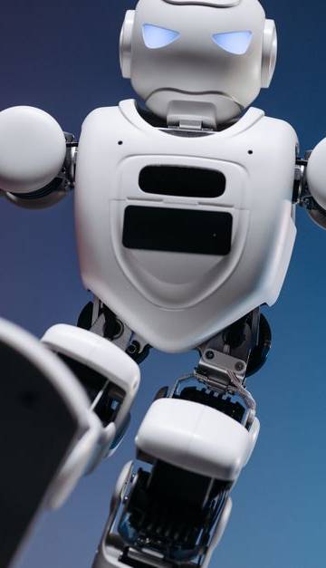 Close-up of a humanoid robot in motion, showcasing modern robotics innovation.