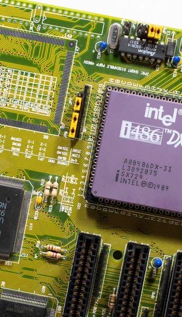 Close-up view of a vintage Intel i486 DX motherboard, highlighting retro technology.