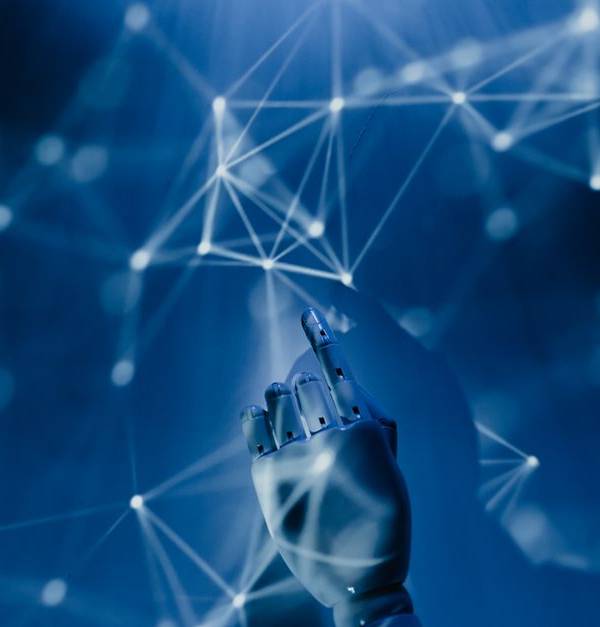A robotic hand reaching into a digital network on a blue background, symbolizing AI technology.