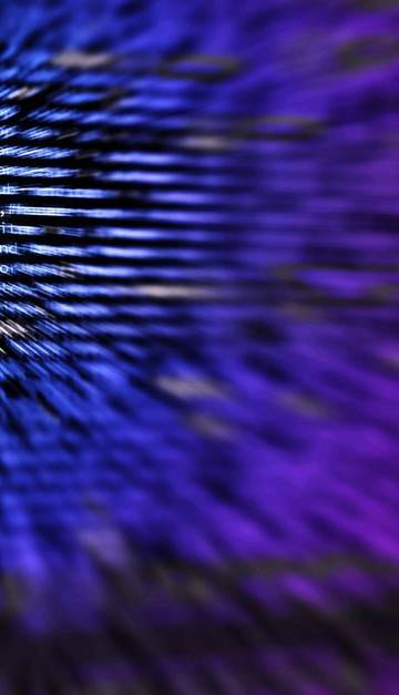 Dynamic abstract background featuring computer code in focus with blurred effect.