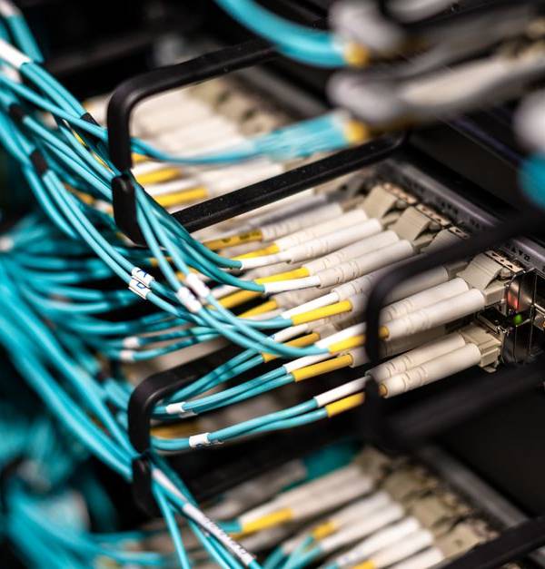 Numerous wires and cables mounted into server patch panel in modern data center