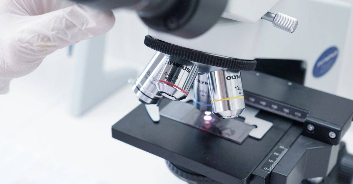 Detailed view of a microscope in a laboratory used in scientific research.