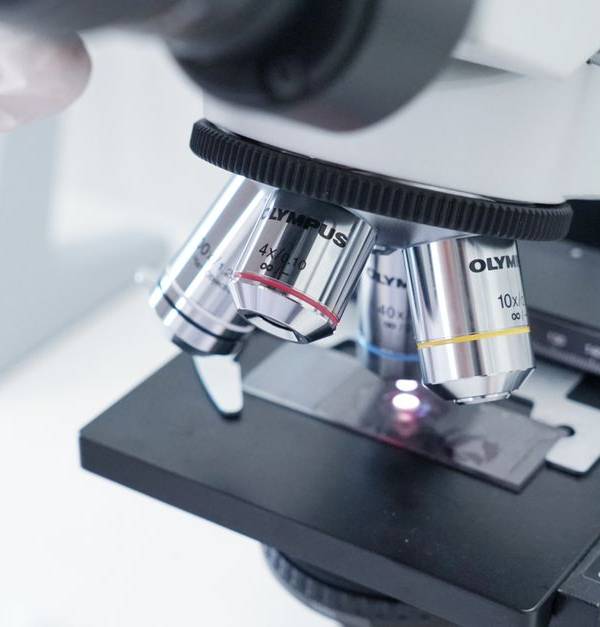 Detailed view of a microscope in a laboratory used in scientific research.
