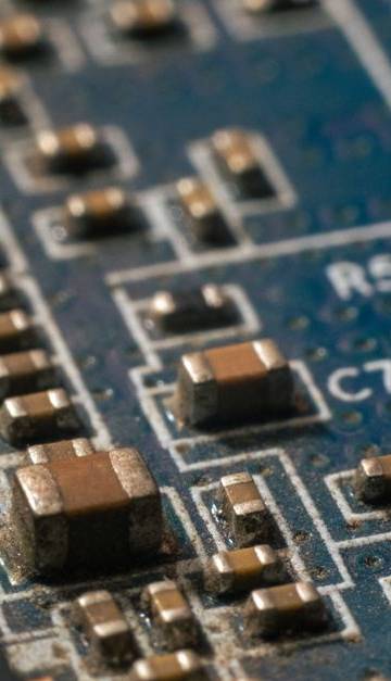 Detailed macro shot of a circuit board highlighting electronic components and traces.