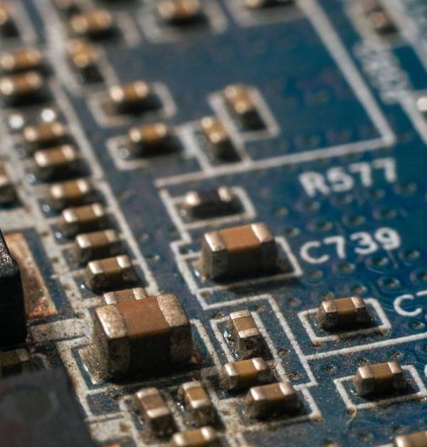 Detailed macro shot of a circuit board highlighting electronic components and traces.