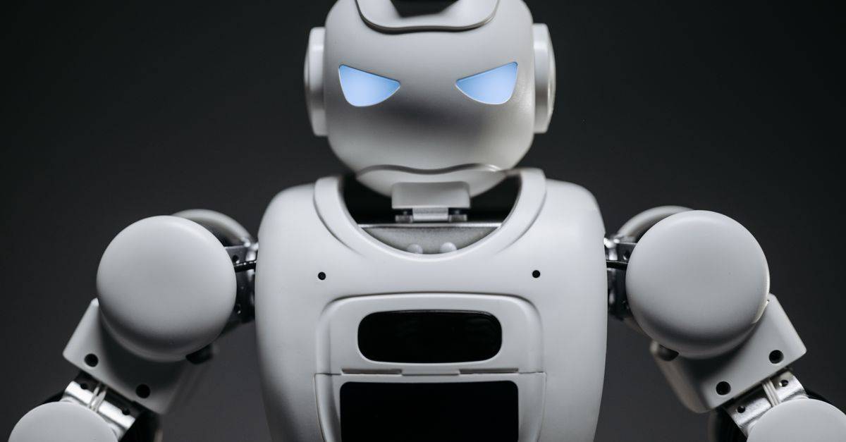 Detailed studio shot of a modern robotic toy with a dark background, showcasing technological design.