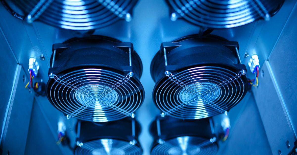 Close-up of cooling fans in a server room, showcasing technology and efficiency.