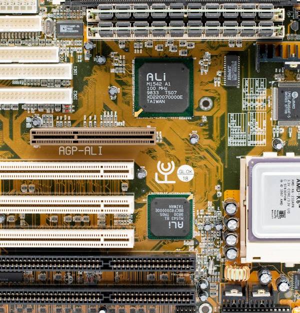 High-angle view of a vintage AMD motherboard showcasing PCI and AGP slots.
