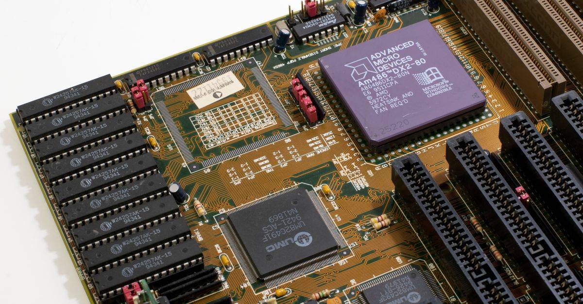 Detailed close-up image of a vintage motherboard showcasing microprocessor and components.