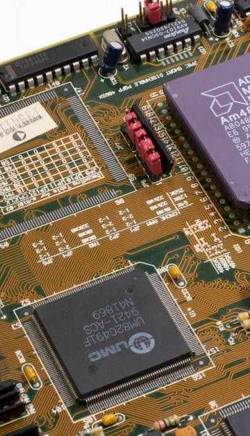Detailed close-up image of a vintage motherboard showcasing microprocessor and components.