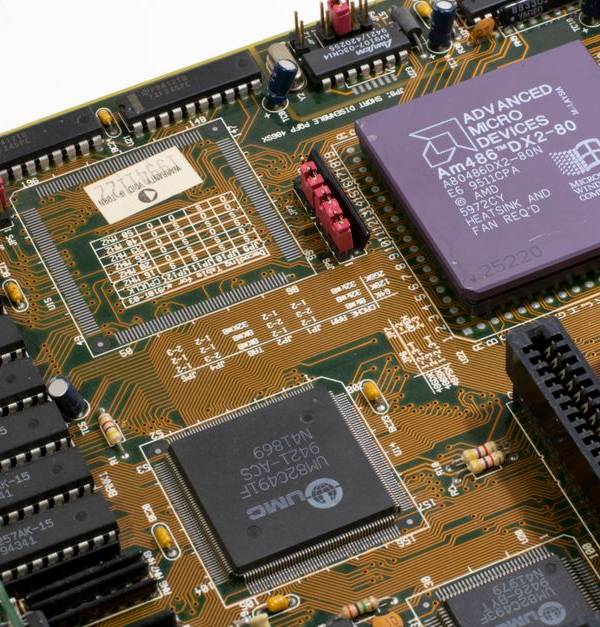Detailed close-up image of a vintage motherboard showcasing microprocessor and components.