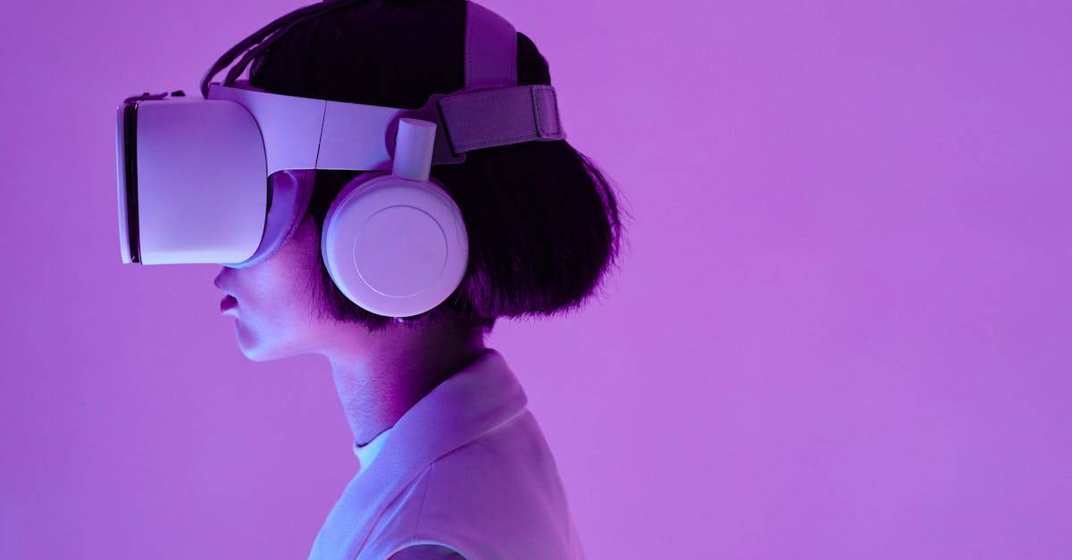 Side view of a woman wearing VR goggles in a purple-lit studio, highlighting modern technology.