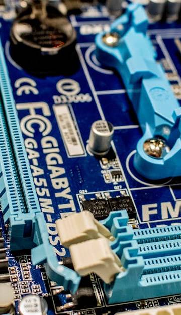 Detailed close-up image of a computer motherboard showcasing various electronic components.