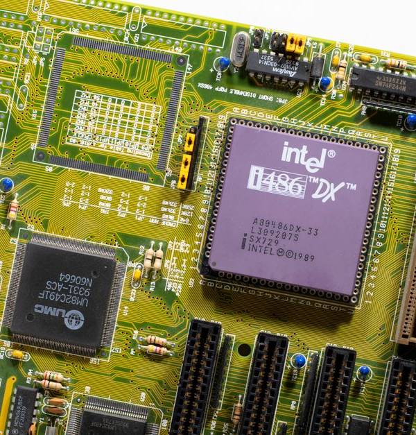 Close-up view of a vintage Intel i486 DX motherboard, highlighting retro technology.