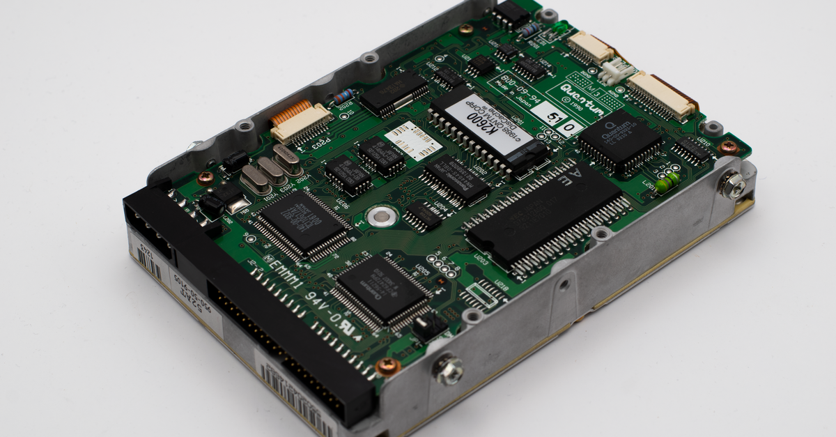 Close-up of a vintage hard drive circuit board showcasing intricate electronic components.