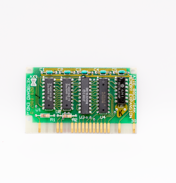 A close-up of a vintage circuit board with microchips, showcasing retro technology and design.