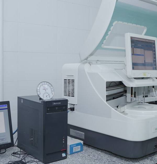 High-tech laboratory equipment with computer system in lab setting.